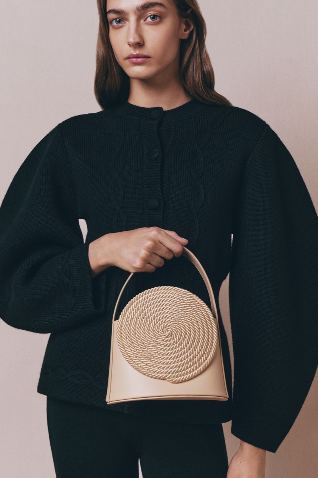 Beige leather bag with passementerie details