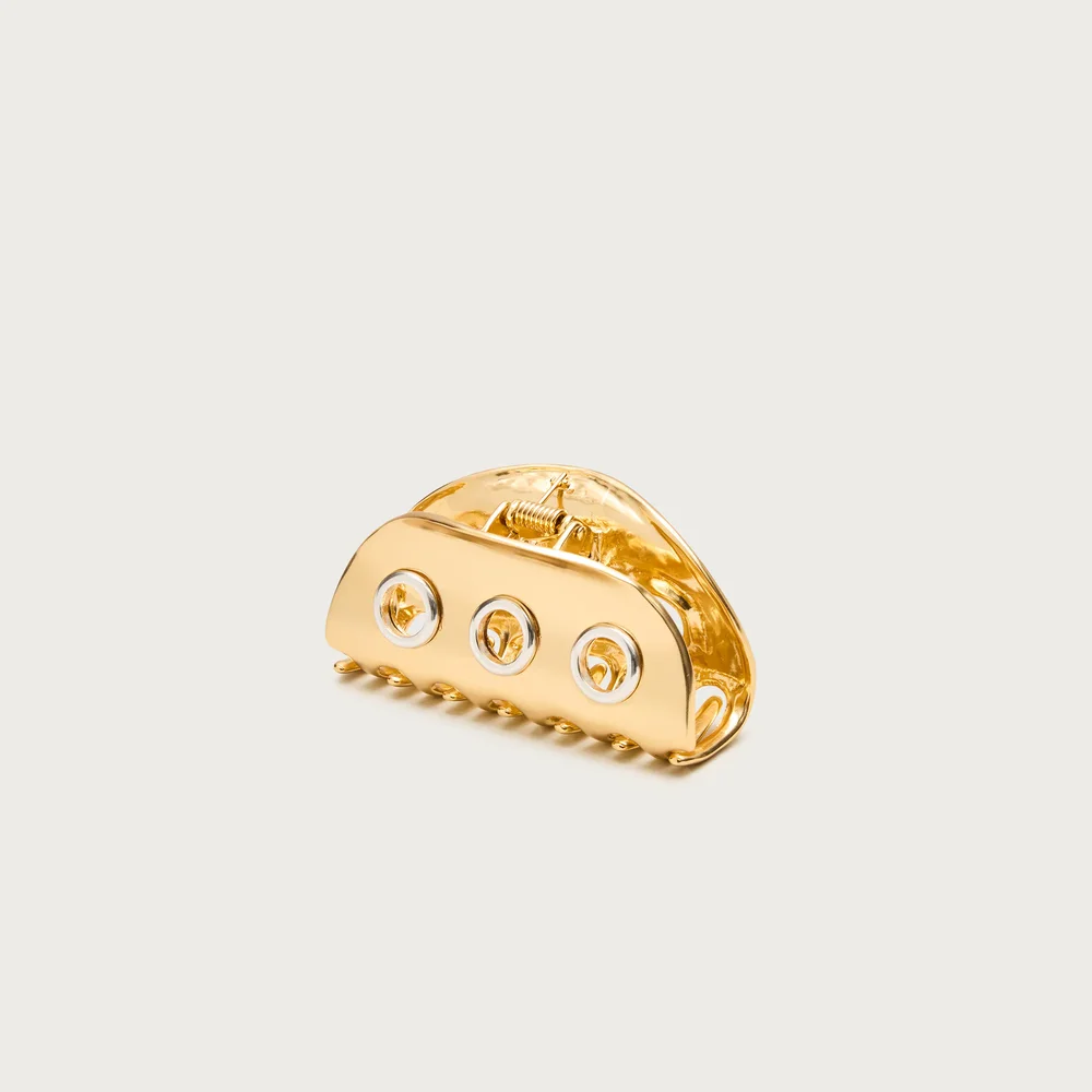 Metallic grommet claw hair clip