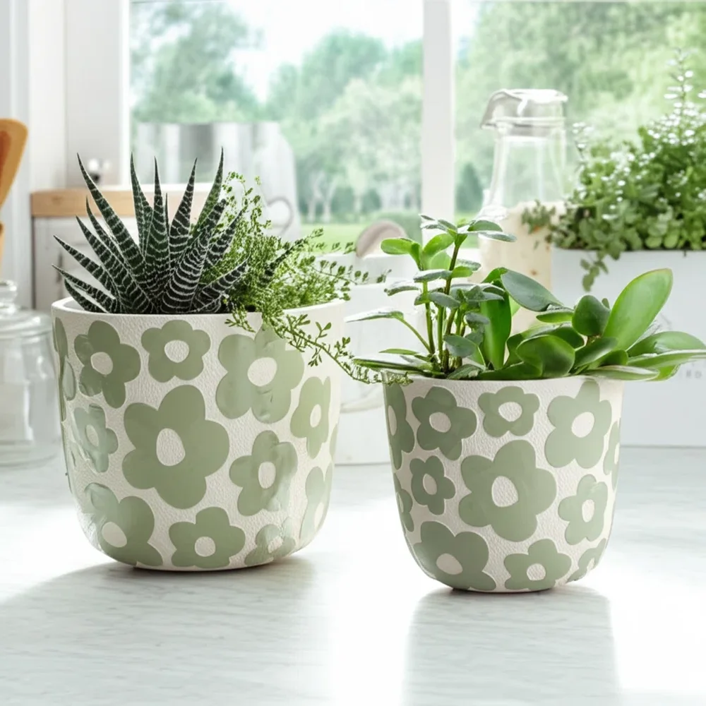 Pottery and Cement Planters With Decorative Design
