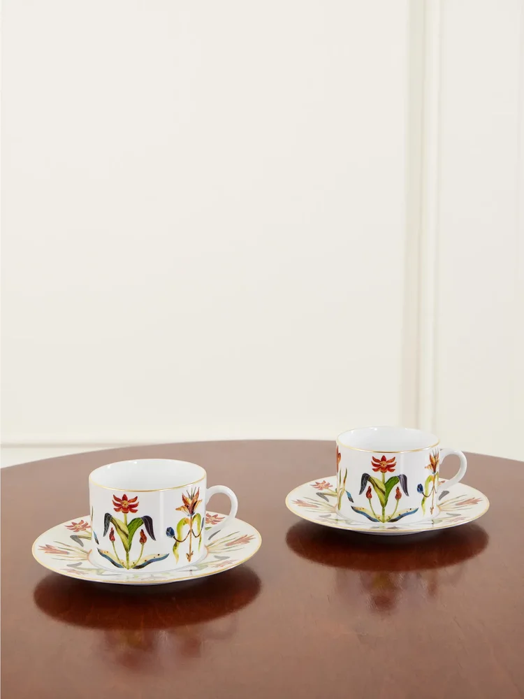 Grand Tour set of two gold-plated porcelain teacups and saucers