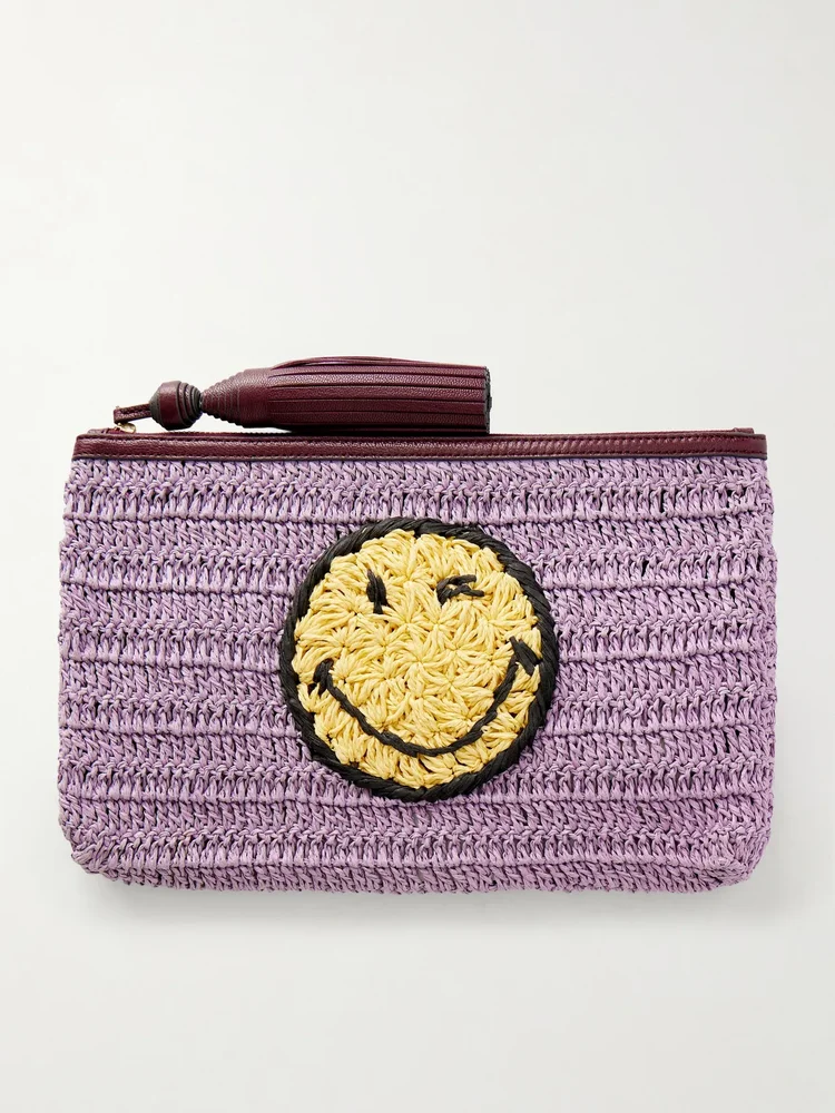 Wink tasseled leather-trimmed raffia clutch bag