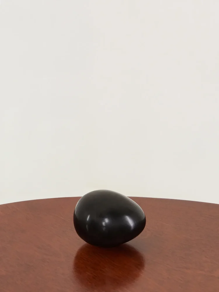 Egg obsidian paperweight