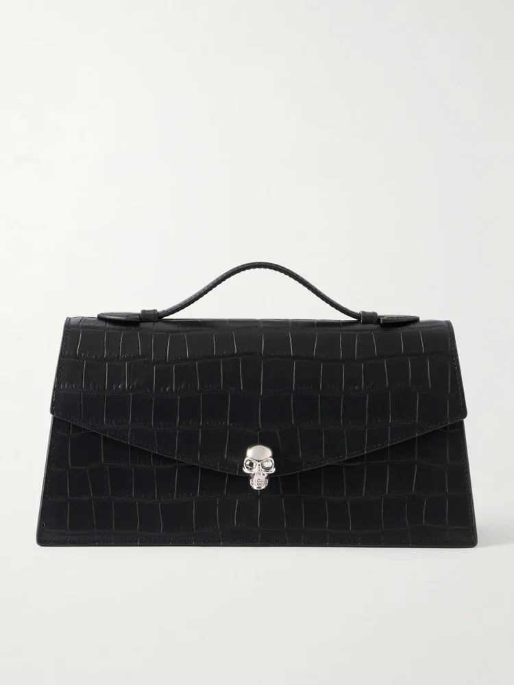 Skull embellished croc-effect leather clutch
