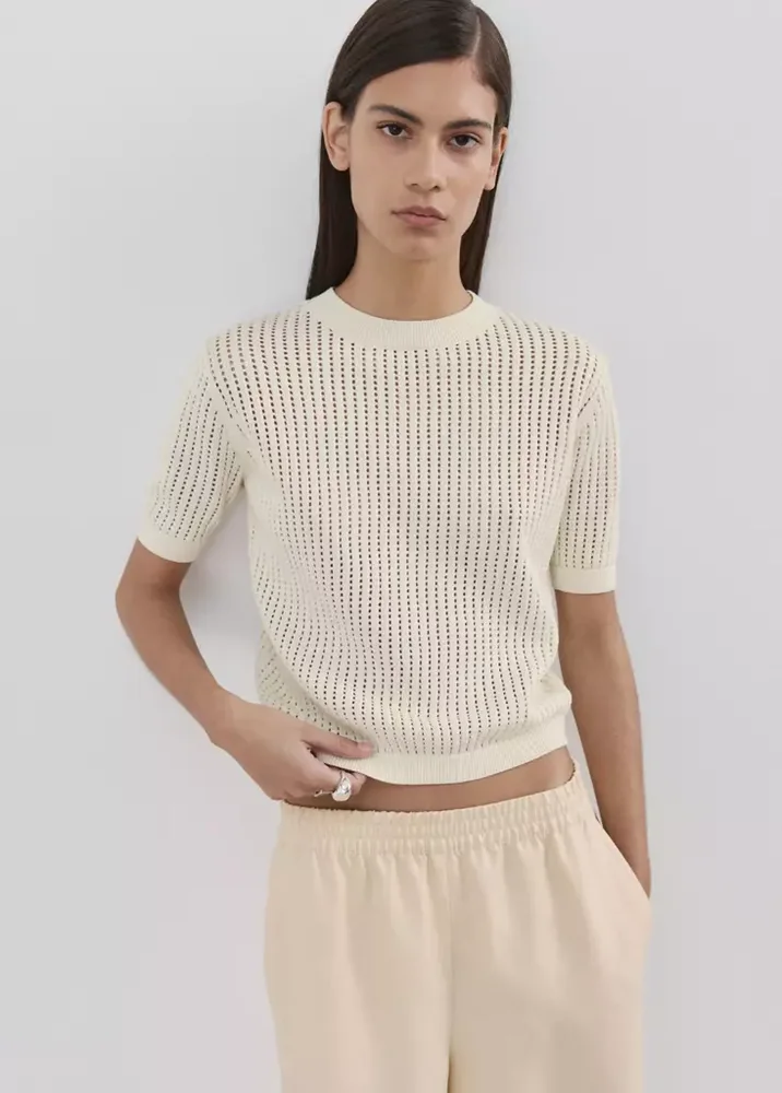 Short-sleeved knitted sweater with lace accents