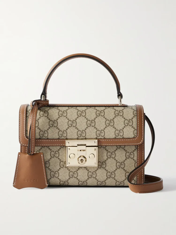 Padlock small leather-trimmed coated canvas-jacquard top-handle bag