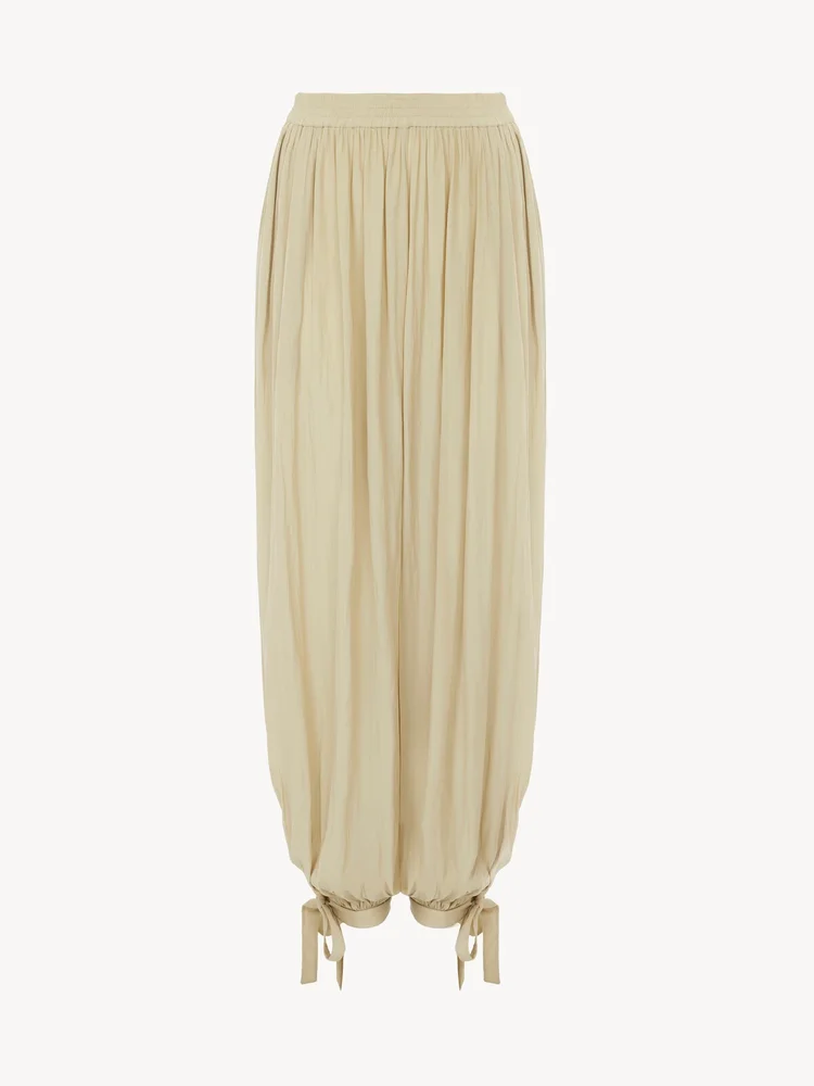 Fluid pleated pants in washed technical satin