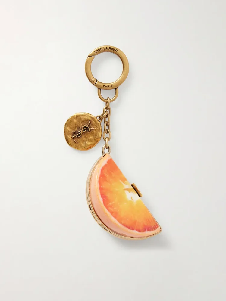 Orange gold-tone and resin bag charm