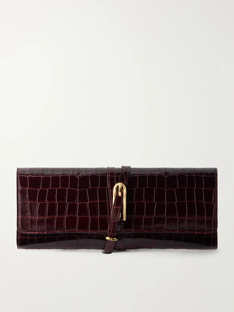 Belted croc-effect leather clutch