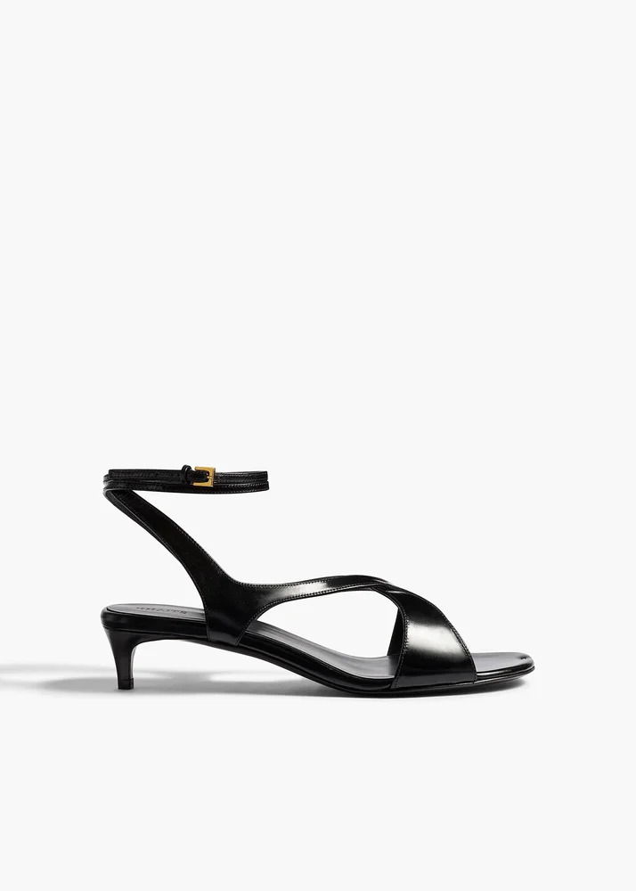 KHAITE Liria Kitten Heel Sandal in Black Glazed Leather