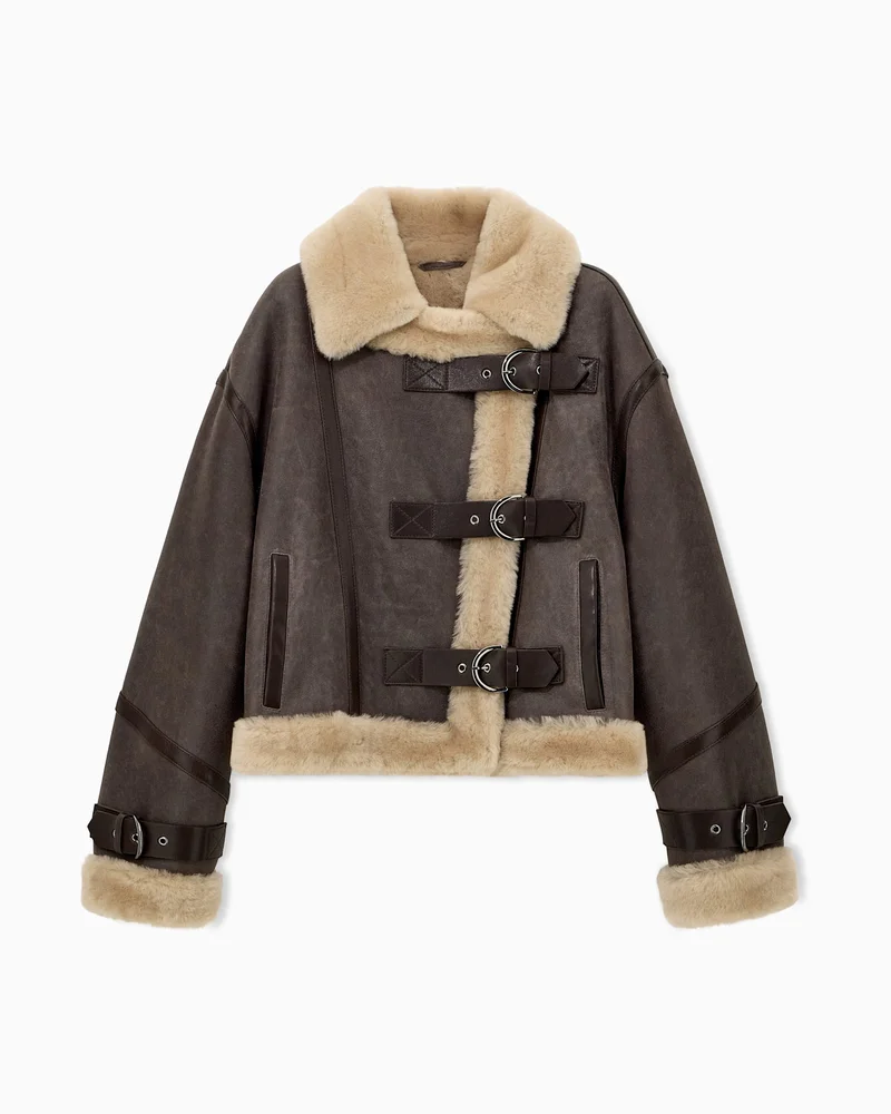 Leather blouson with a shearling collar and buckle straps