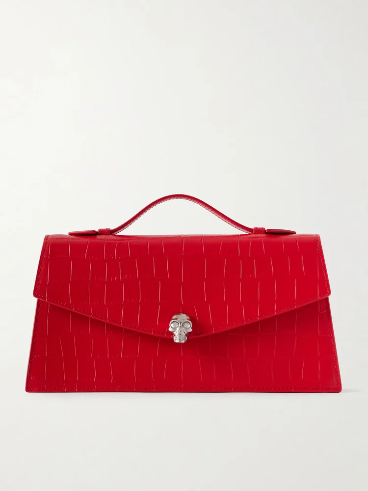 Skull embellished croc-effect leather clutch