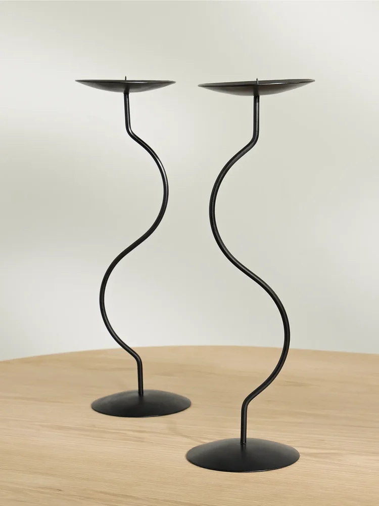Dancing Duo set of two iron candlesticks