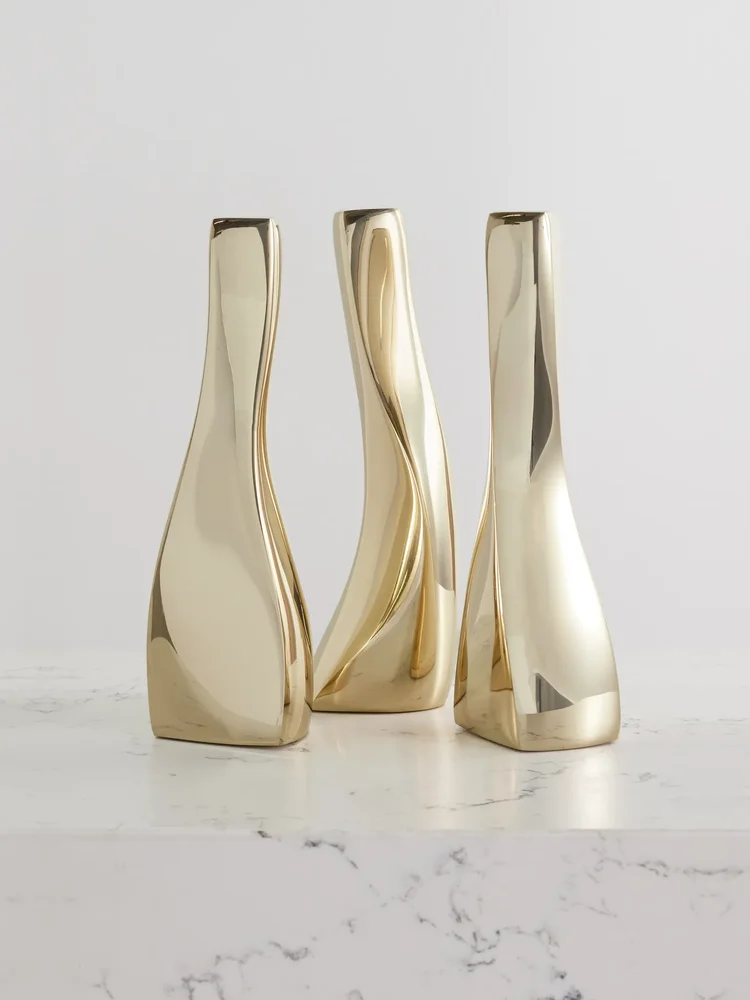 Set of three gold-tone candlesticks